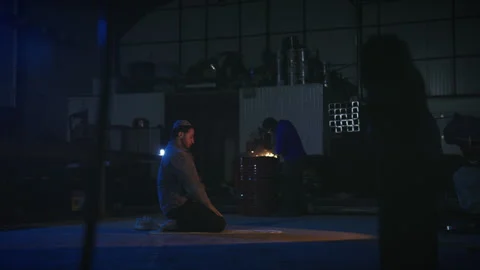 Muslim worker sitting in prayer position at workplace Stock Footage 317582542