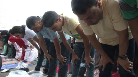 Muslims bowing in prayer to Allah Stock Footage 82318174