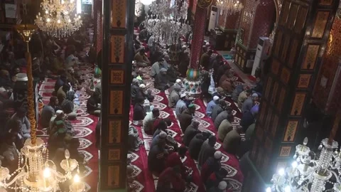 Muslims in Srinagar attend first Friday prayers during holy month of Ramadan, IN Stock Footage 329294349