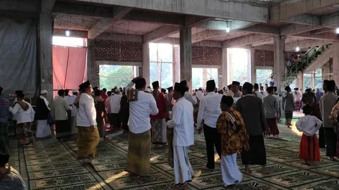 Muslims when performing Eid al-Adha prayers at the mosque Stock Footage 114700375