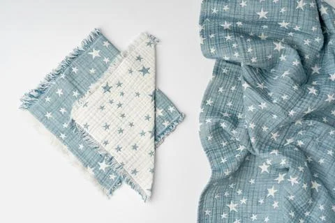 Muslin blanket with star pattern on white background Stock Photos