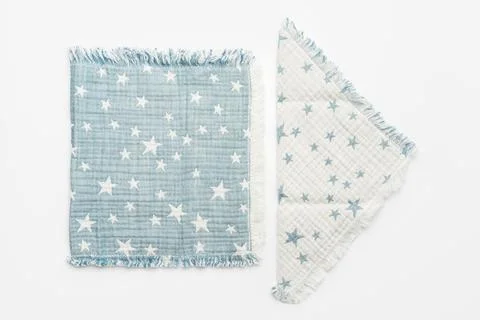 Muslin blanket with star pattern on white background Stock Photos