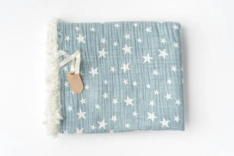 Muslin blanket with star pattern on white background Stock Photos