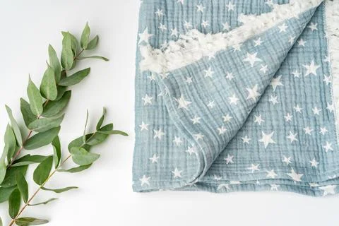 Muslin blanket with star pattern on white background Stock Photos