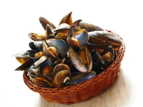 Mussels in basket Stock Photos
