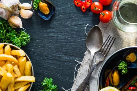 Mussels in pan on rustic background Stock Photos