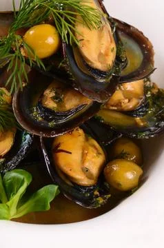 Mussels in the shell with sauce Stock Photos