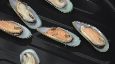 Mussels in shells on baking sheet for baking in oven. HD Stock Footage 141744182