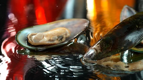 Mussels slowly fall on a table with water,SLOW MOTION,4k, phantom Stock Footage 114977132