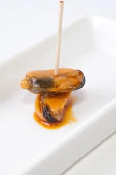 Mussels with toothpicks Stock Photos