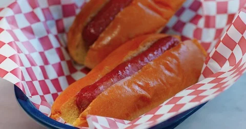 Mustard being squirted onto hotdog Stock Footage 99733490