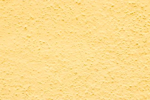 Mustard colored wall texture Stock Photos