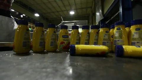 Mustard containers on cart 스톡 동영상 77053649