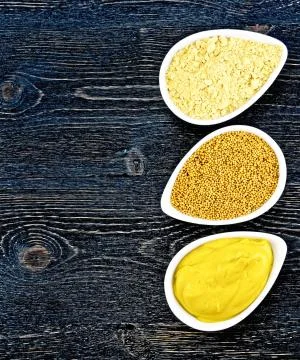 Mustard different on board Stock Photos