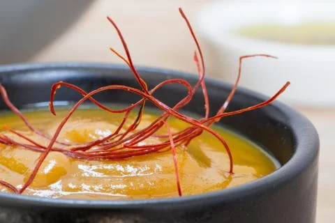 Mustard dip with chili threads macro on wood background Stock Photos