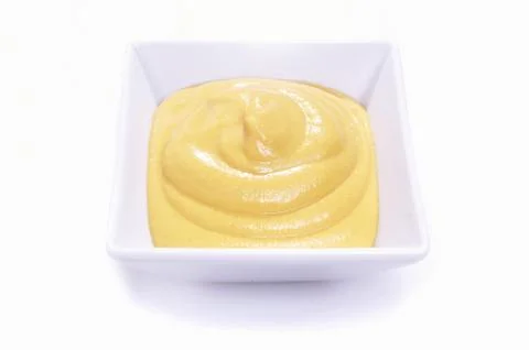 Mustard in dish Stock Photos