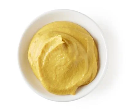 Mustard in round dish Stock Photos