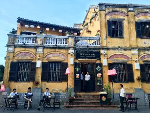 Mustard yellow building at Hoi An ancient town, Vietnam Stock Photos