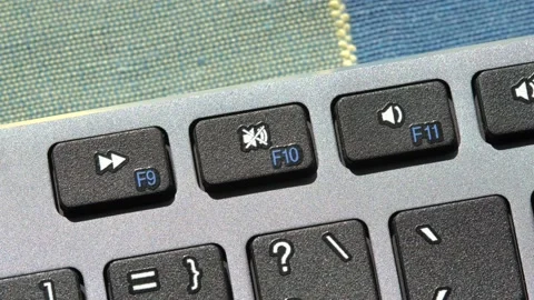 Mute button, sound off key on a modern computer keyboard, top view, mute butt Stock Footage 220420468