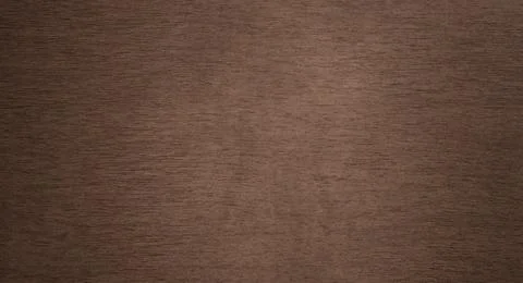 A muted dark brown background with a fine, horizontal texture. The surface .. Stock Photos