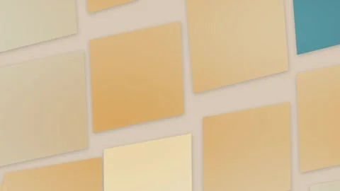 Muted golden tiles float across a creamy surface with subtle turquoise acce.. Stock Footage 347385638