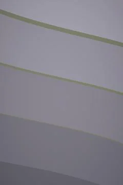 A muted gray abstract background features several thin diagonal olive-gray .. Иллюстрация