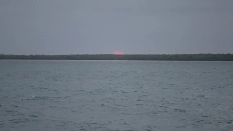 Muted Sunset Over Soft Ocean Ripples Stock Footage 305957294