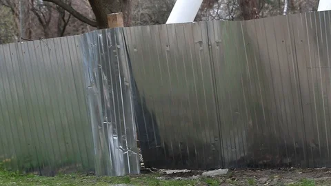 Mutilated Damaged construction fence. Stock Footage 110708146