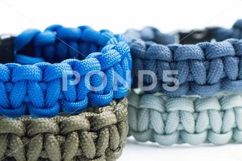 Mutliple Survival Wristlet Paracord close up and isolated on white Stock Photos