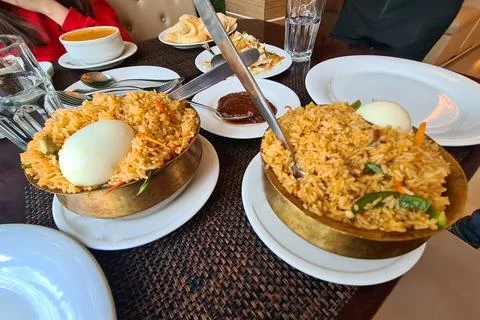 Mutton Biryani with rice, egg, pepper, and delicious spices Stock Photos