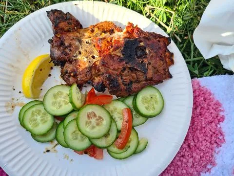 Mutton or beef steak fried meat with cucumber slice Stock Photos