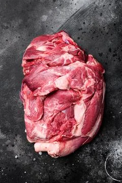 Mutton or lamb Fresh raw meat, on black dark stone table background, top view Stock Photos