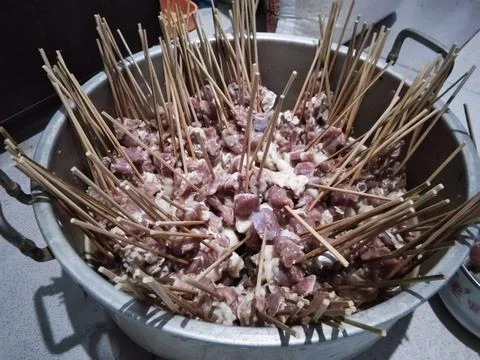 Mutton satay in a pot that is ready to be grilled Stock Photos