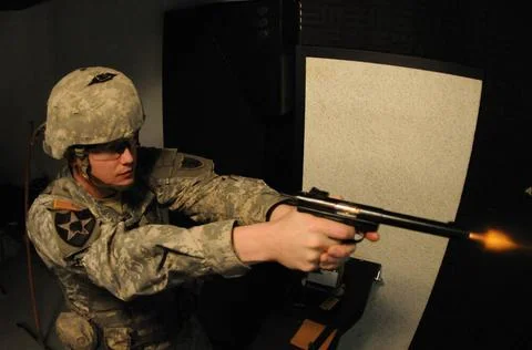 The muzzle blast can be seen at the end of the pistol barrel of North Dako... Foto stock