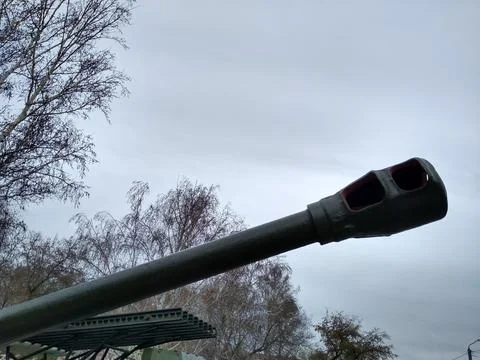 The muzzle of a cannon or tank or other military equipment against the sky Foto stock