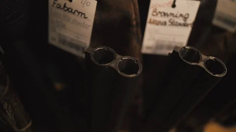 Muzzle of double barreled shotguns pointed - macro shooting. Hunting rifle takes Stock Footage 98657398