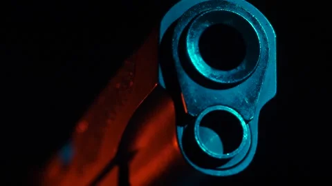 Muzzle of handgun against background of flashes of shots Stock Footage 275371692