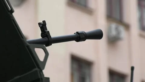 The muzzle of a machine gun. Close-up. A real war. Stock Footage 256132379
