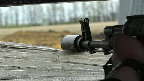 The muzzle of the machine gun looks out the window of the loophole, moves to the Stock Footage 239713121