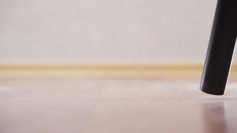 The muzzle of a vacuum cleaner close-up vacuums under Stock Footage 168055112