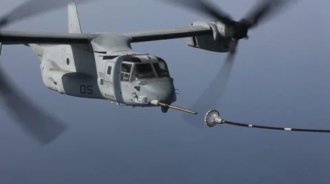 MV-22B Ospreys and  KC-130J Hercules conduct aerial refueling training Stock Footage 33689861