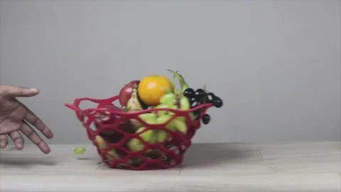 MVI 9915fruit basket sliding on table.  background stock footage. Stock Footage 155110116