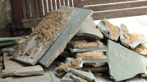 MVI Worker working hard, removing tiles, keeping aside tiles. Stock Footage 245093753