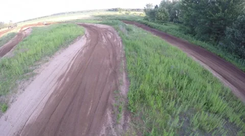 Mx aerial view of rider passing under drone 2.7k Stock Footage 52189647
