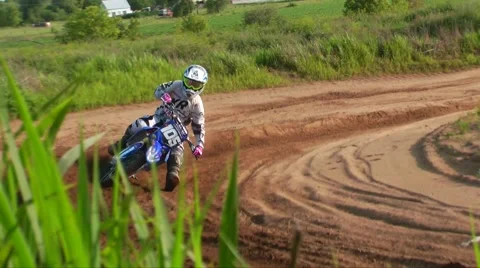 Mx racer flying through corners Stock Footage 52136702