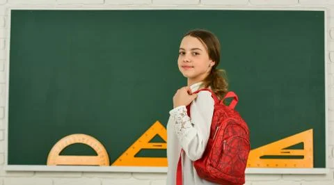 My backpack is just right. Smart schoolgirl. School education. Knowledge day 写真素材