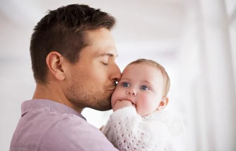 My beautiful baby girl. a young father holding his adorable baby girl. Stock Photos
