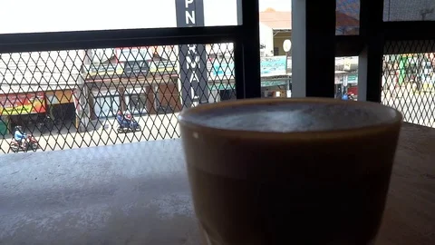 My coffee drink while im at upnormal cafe in bogor city, west java, Stock Footage 116966458