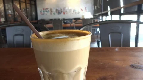 My coffee drink while im at upnormal cafe in bogor city, west java, Stock Footage 116966543