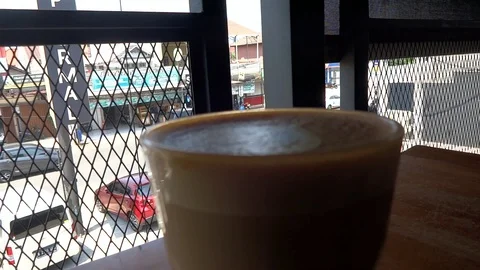 My coffee drink while im at upnormal cafe in bogor city, west java, Stock Footage 117024317